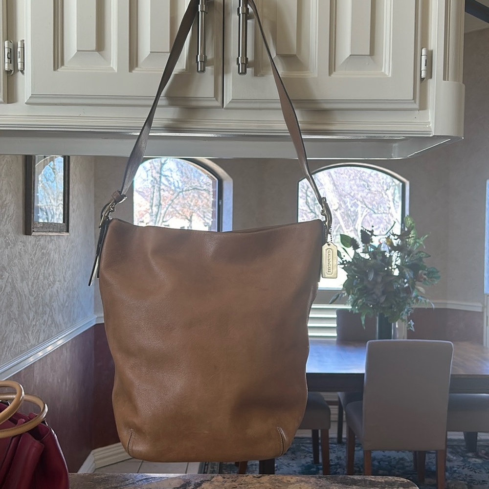 Coach shoulder bag. Light brown/tan. Carried a few times. Excellent condition.